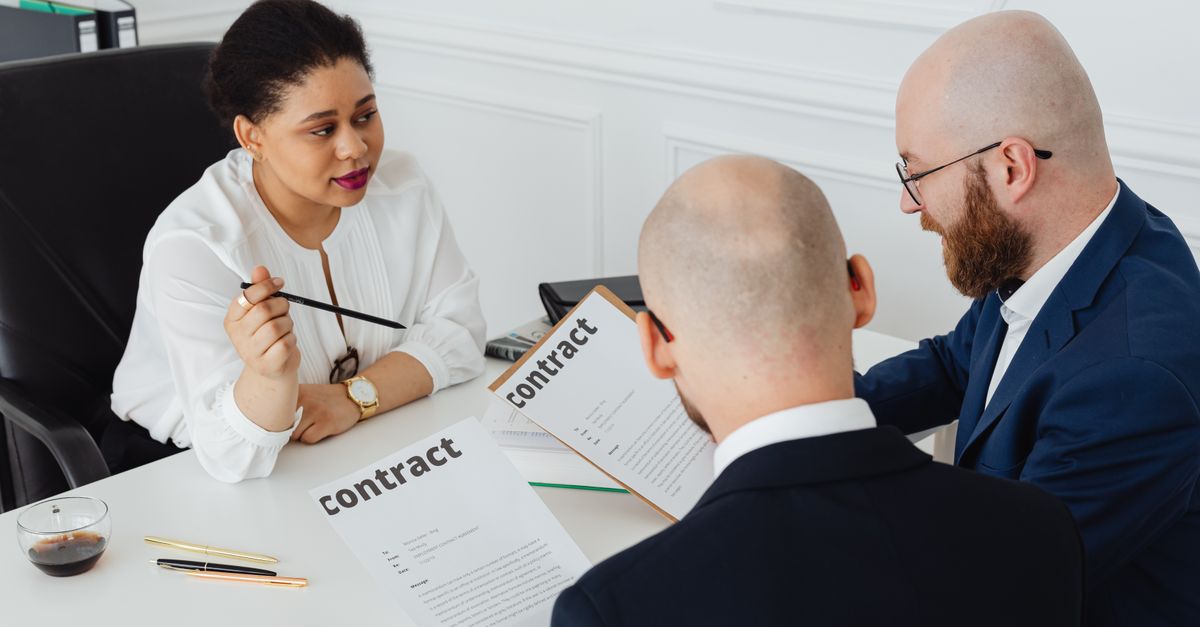 Employee and employer reviewing an employment contract under Morocco's Labor Code